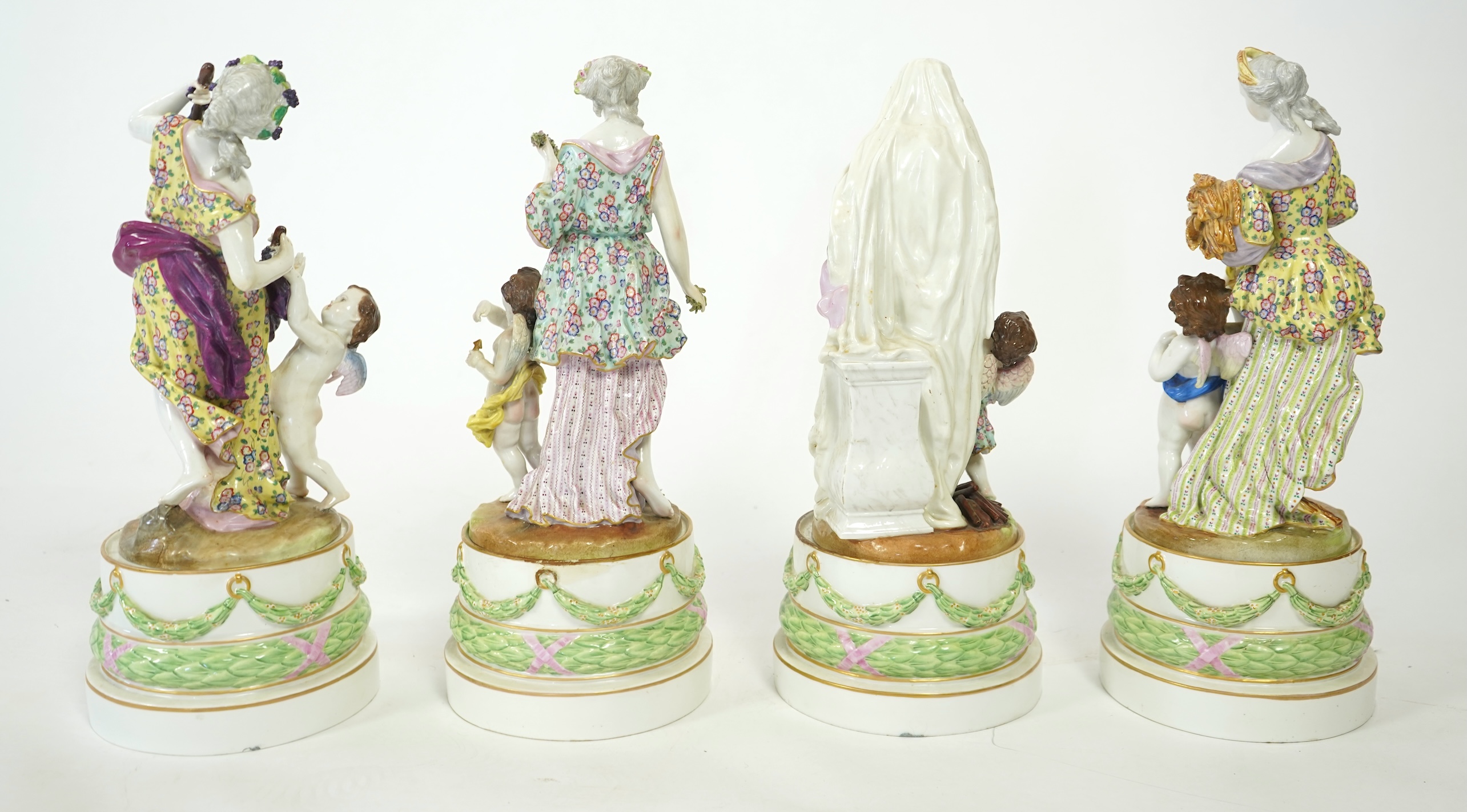 A set of four large Meissen style 'Four Seasons' groups and separate pedestals